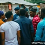 나이지리아의 LGBT 인권 현황 - A tense urban street scene in Nigeria at dusk, showing a diverse group of LGBT activists meeting dis...